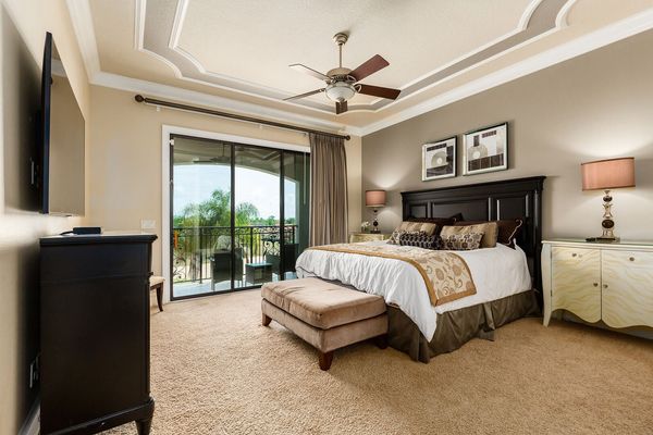 Master suite bedroom 4 features a king bed, en-suite bathroom, 55-inch SMART TV, and access to patio balcony