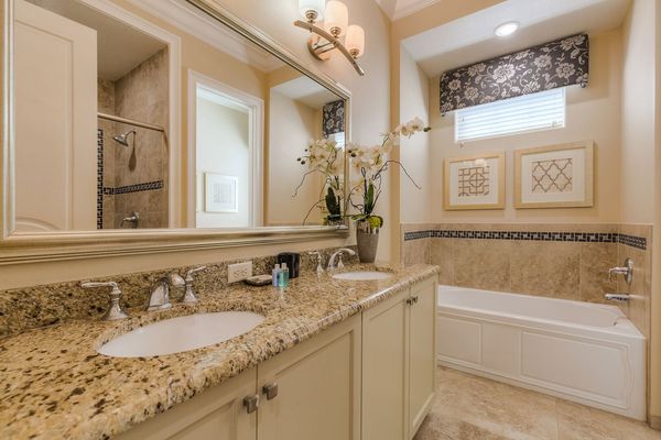 The en-suite bathroom 4 has a bathtub and glass walk-in shower