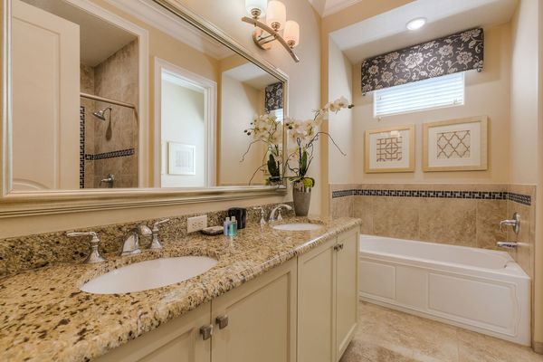 The en-suite bathroom 4 has a bathtub and glass walk-in shower