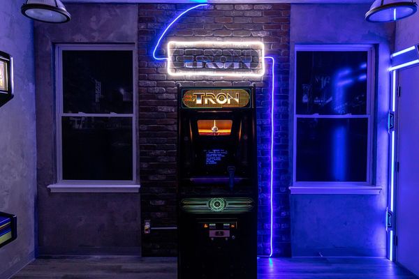 Enter your secret passage via the Tron arcade to the space room