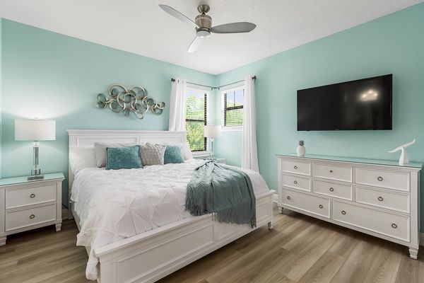 Second floor Master Suite furnished with king-size bed