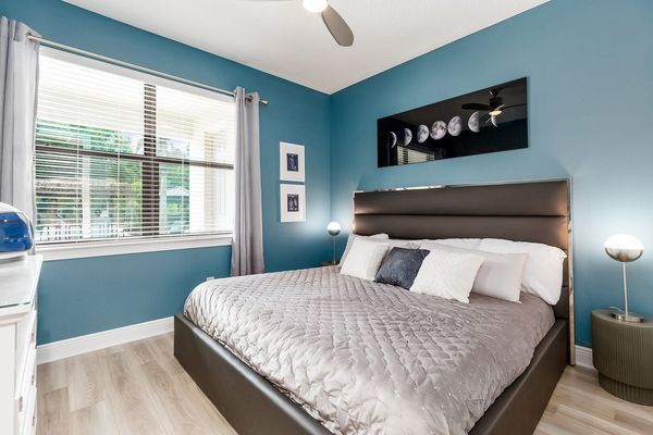 First floor Master Suite furnished with king-size bed