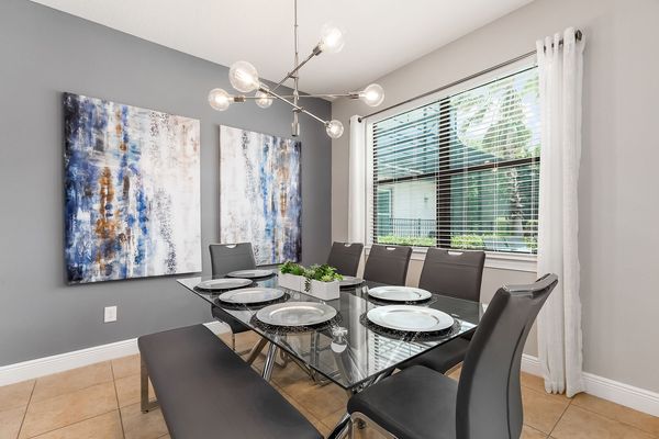 One side of the formal dining table has bench seating