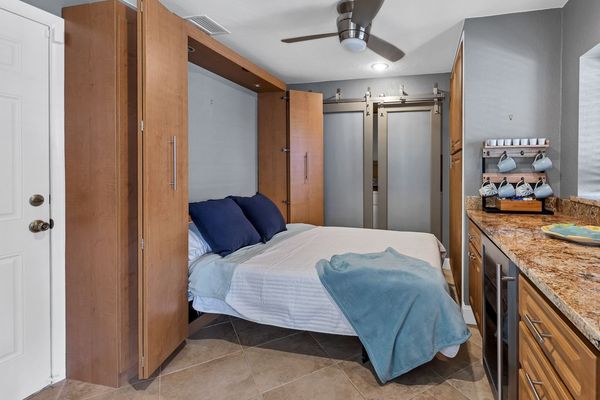 Queen murphy bed off kitchen