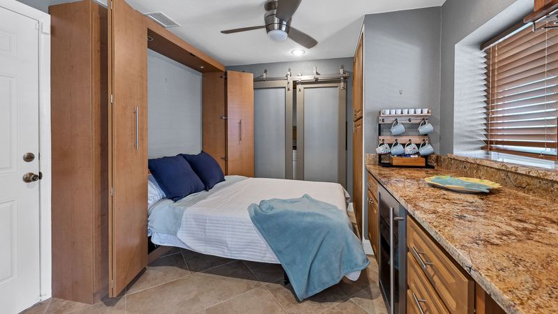 Queen murphy bed off kitchen
