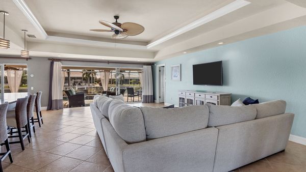 Living room overlooking patio and canal