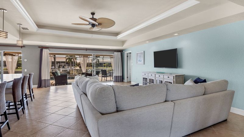 Living room overlooking patio and canal