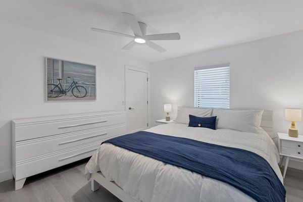 King bed in guest bedroom with 55" Smart TV