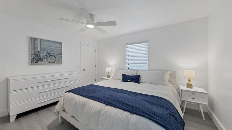 King bed in guest bedroom with 55" Smart TV