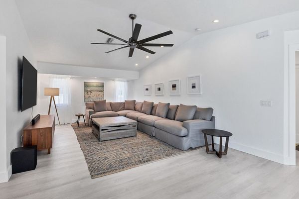 Large and comfortable living room with 84" Smart TV featuring Dolby surround sound