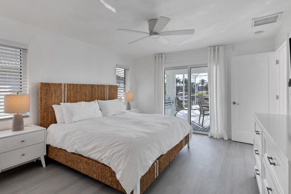 King bed in the master bedroom with lanai access
65" TV