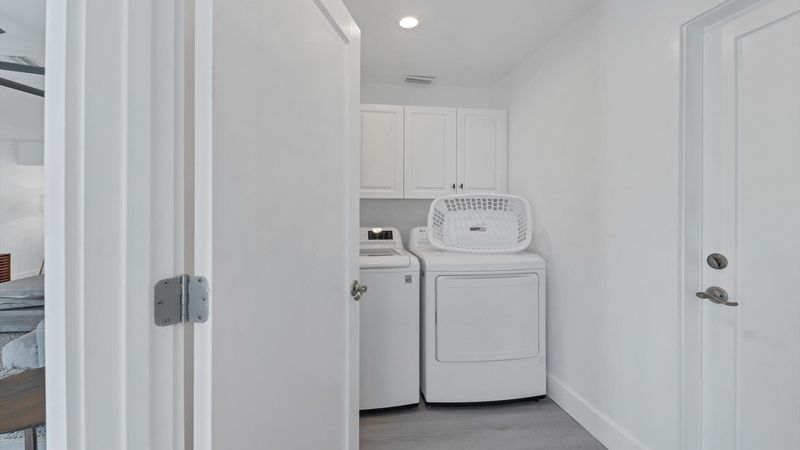 Full size washer and dryer in laundry room