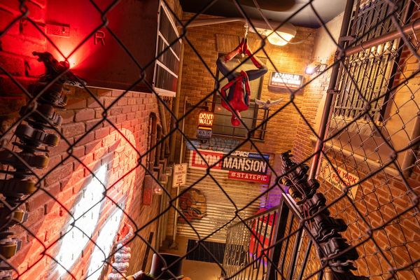Journey through a 1980s NYC alleyway seeing a familiar web-slinging superhero