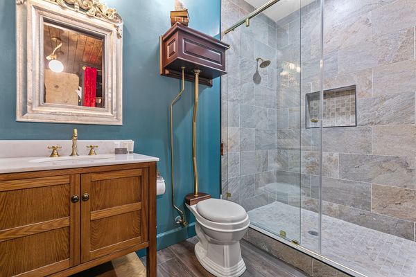 En-suite bathroom features a walk in shower.