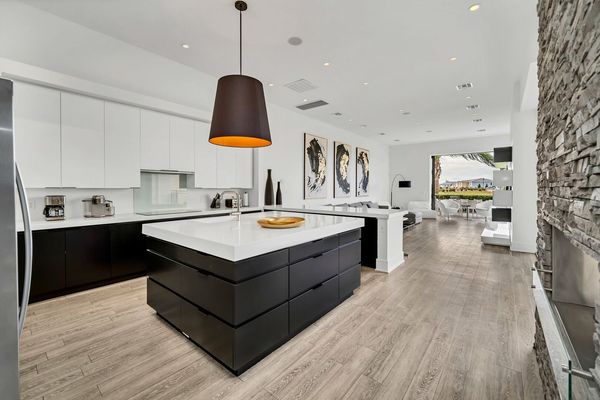 The living room space, kitchen, and dining area have a modern flair