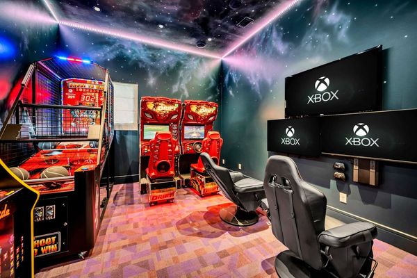 The galaxy-themed game room offers Fast and Furious Drift side-by-side racers, Shoot to Win basketball, a multi-arcade game, and Xbox with 3 Smart TV's and gaming chairs