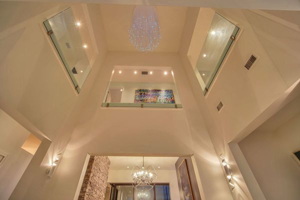 The impressive 2-story foyer greets you as you walk into the home