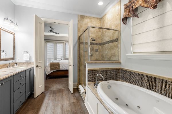 This bedroom comes with a private bathtub.