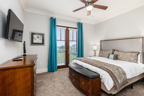 This bedroom comes with a king bed and minimalist design.