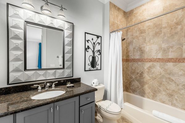 This bedroom comes with a personal bathroom