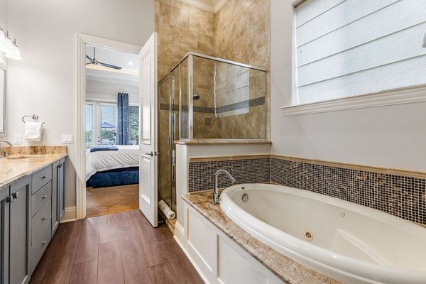 This bedroom comes with a private bathtub.