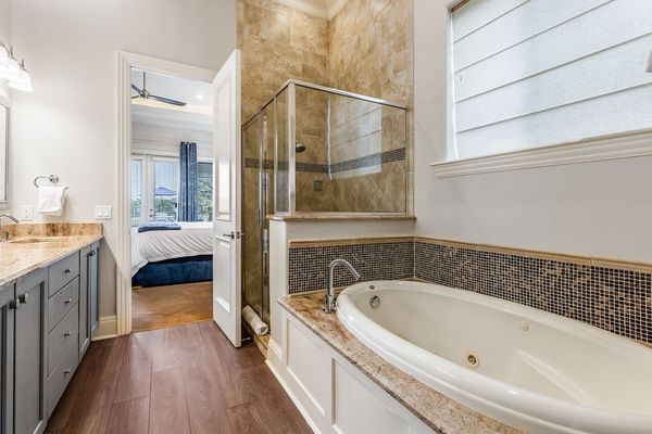 This bedroom comes with a private bathtub.