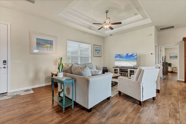 Open, comfortable living room with 65-inch Smart TV