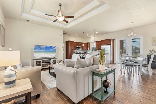 Open, comfortable living room with 65-inch Smart TV