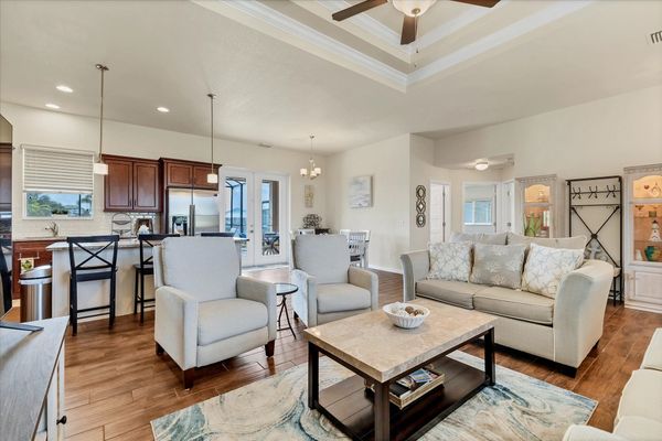 Open, comfortable living room with 65-inch Smart TV