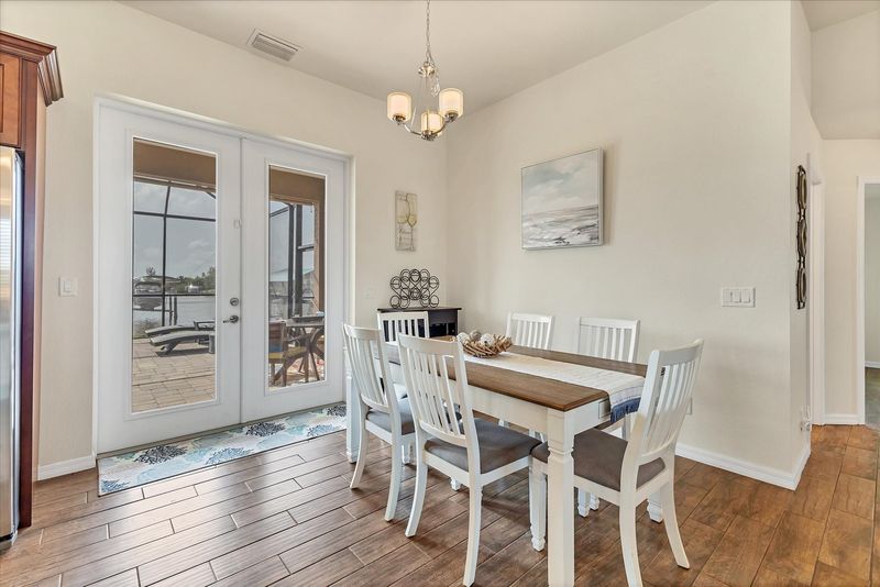 Dining area with lanai access. Dining table seats 6