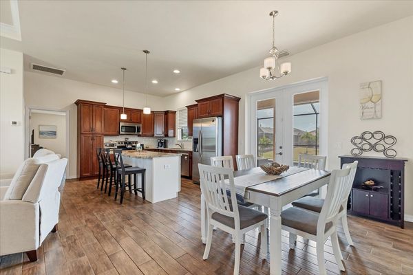 Dining area with lanai access. Dining table seats 6