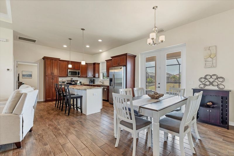 Dining area with lanai access. Dining table seats 6