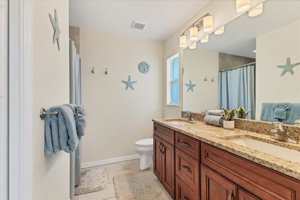 En suite features walk-in shower and double vanities