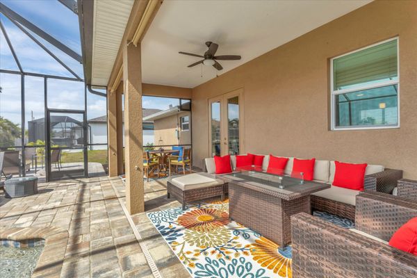 Beautiful outdoor living space over looking the sparkling pool and canal