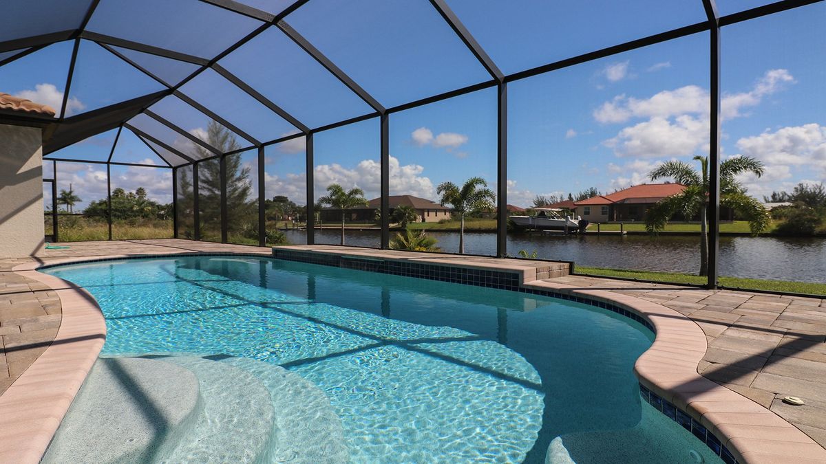 Gorgeous South Gulf Cove canal home with private pool (Boat lift not available)