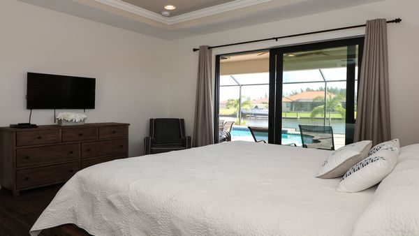 King bedroom master suite with patio access. 42" Smart TV & DVD player.
