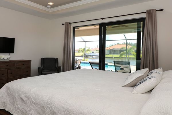 King bedroom master suite with patio access. 42" Smart TV & DVD player.