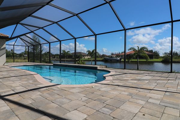 Spacious pool deck overlooking the canal