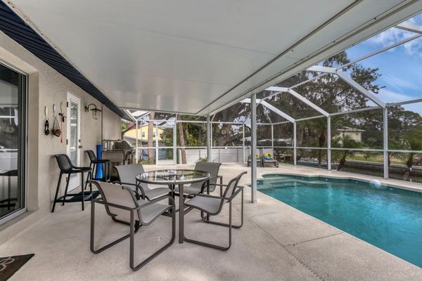 Relax outside by the pool overlooking the canal