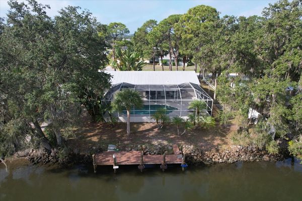 Backyard with pool and canal/dock (Boat lift not available)