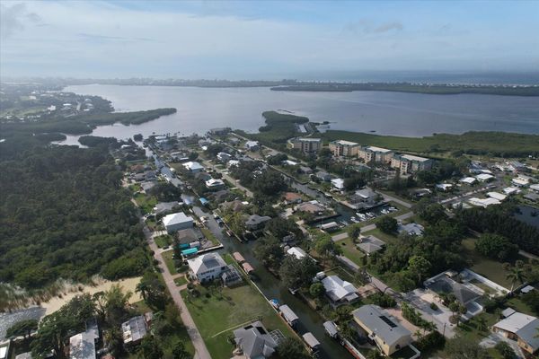 Aerial view of house and Lemon Bay with the Gulf of Mexico just beyond (Boat lift not available)