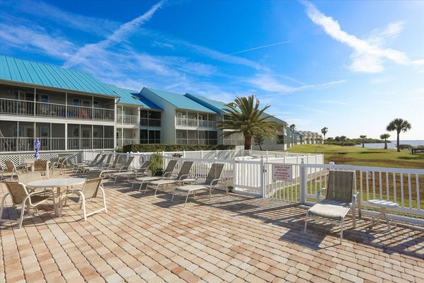 Community pool with plenty of lounge seating