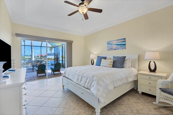 Airy primary bedroom with king bed