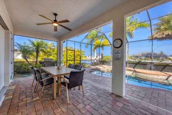 Beautiful, spacious outdoor living space overlooking private pool & canal