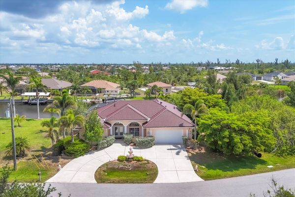 Beautiful South Gulf Cove home with private pool, hot tub, and canal access