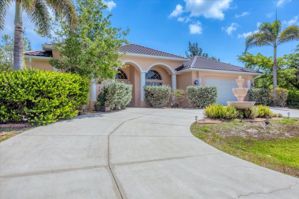 Beautiful South Gulf Cove home with private pool, hot tub, and canal access