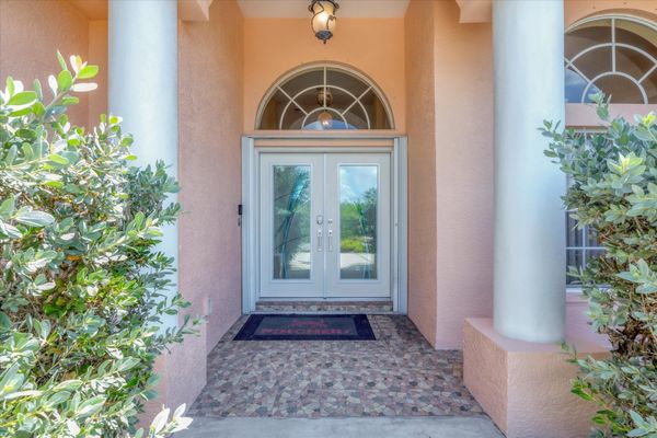 Beautiful South Gulf Cove home with private pool, hot tub, and canal access