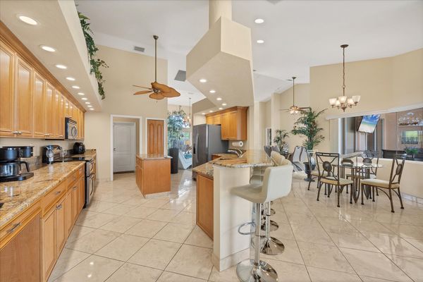 Large, open, fully-equipped kitchen overlooking breakfast table & living room