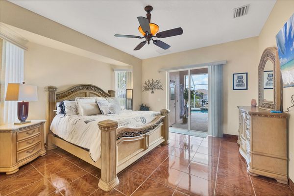 Primary bedroom with king bed, ensuite and lanai access