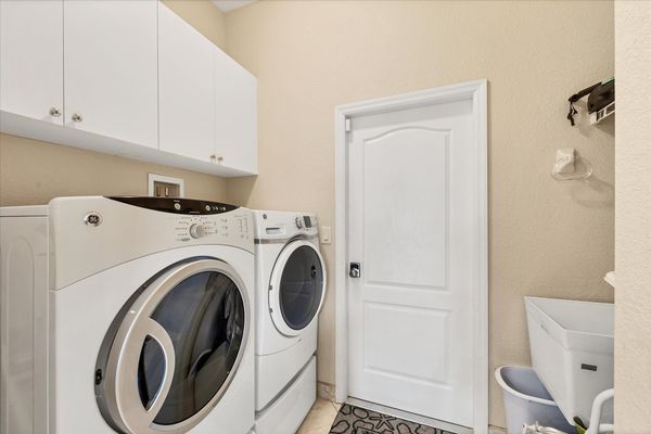 Laundry room with full-size washer and dryer